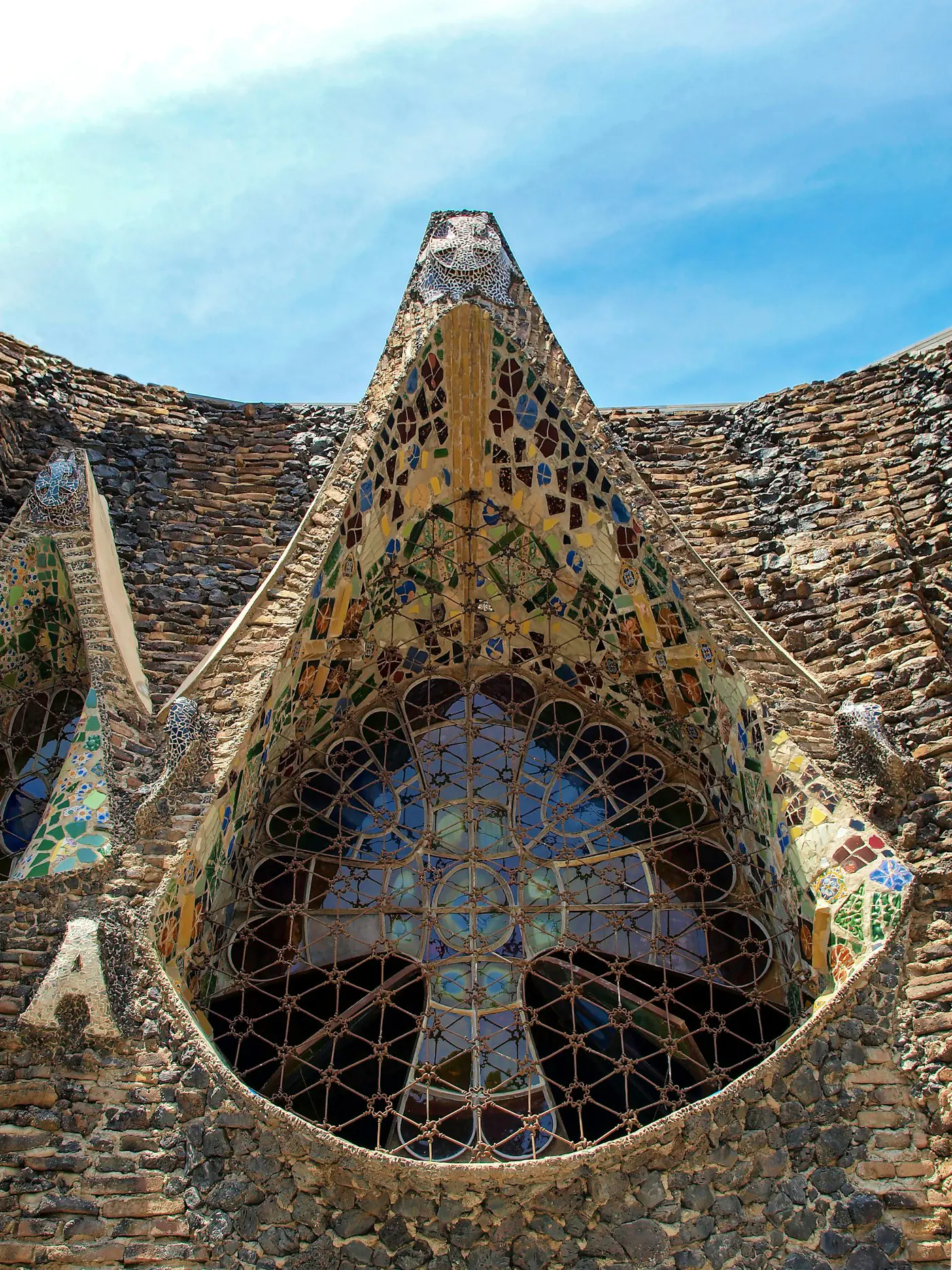 Trencadís mosaic and the great window of Gaudí's crypt at Colònia Güell